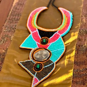 Beaded necklace with Celtic crest insert